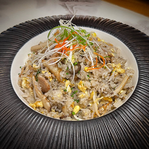 Arroz frito con pato hongos y trufa